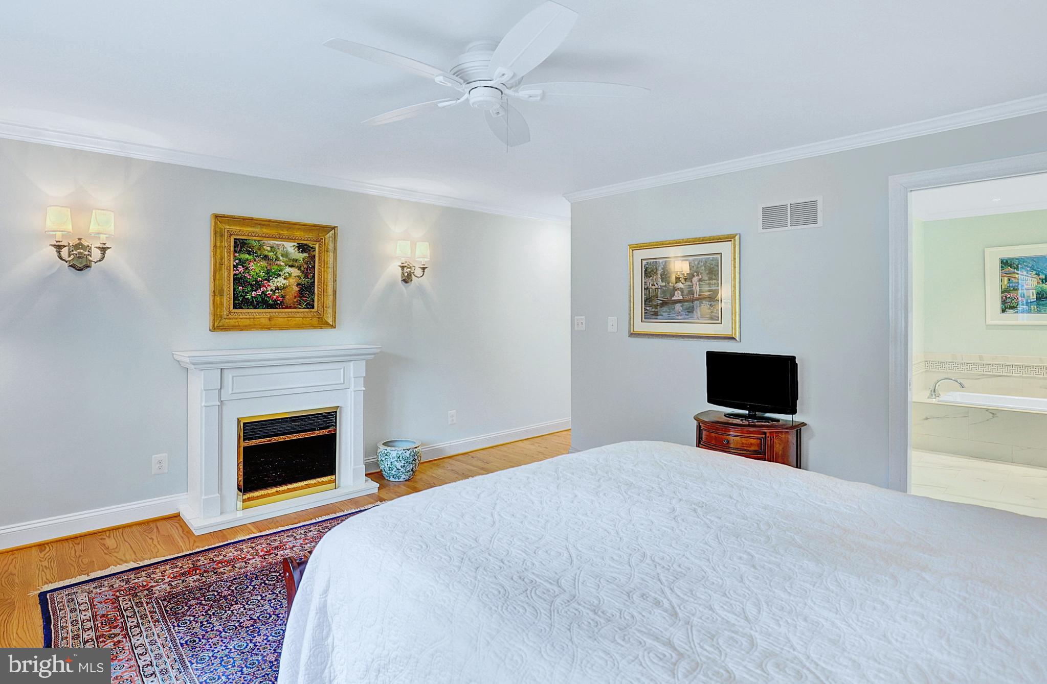 13713 Harcum Road Phoenix, MD 21131 - Photo 34 of 101 a bedroom with a bed and a television