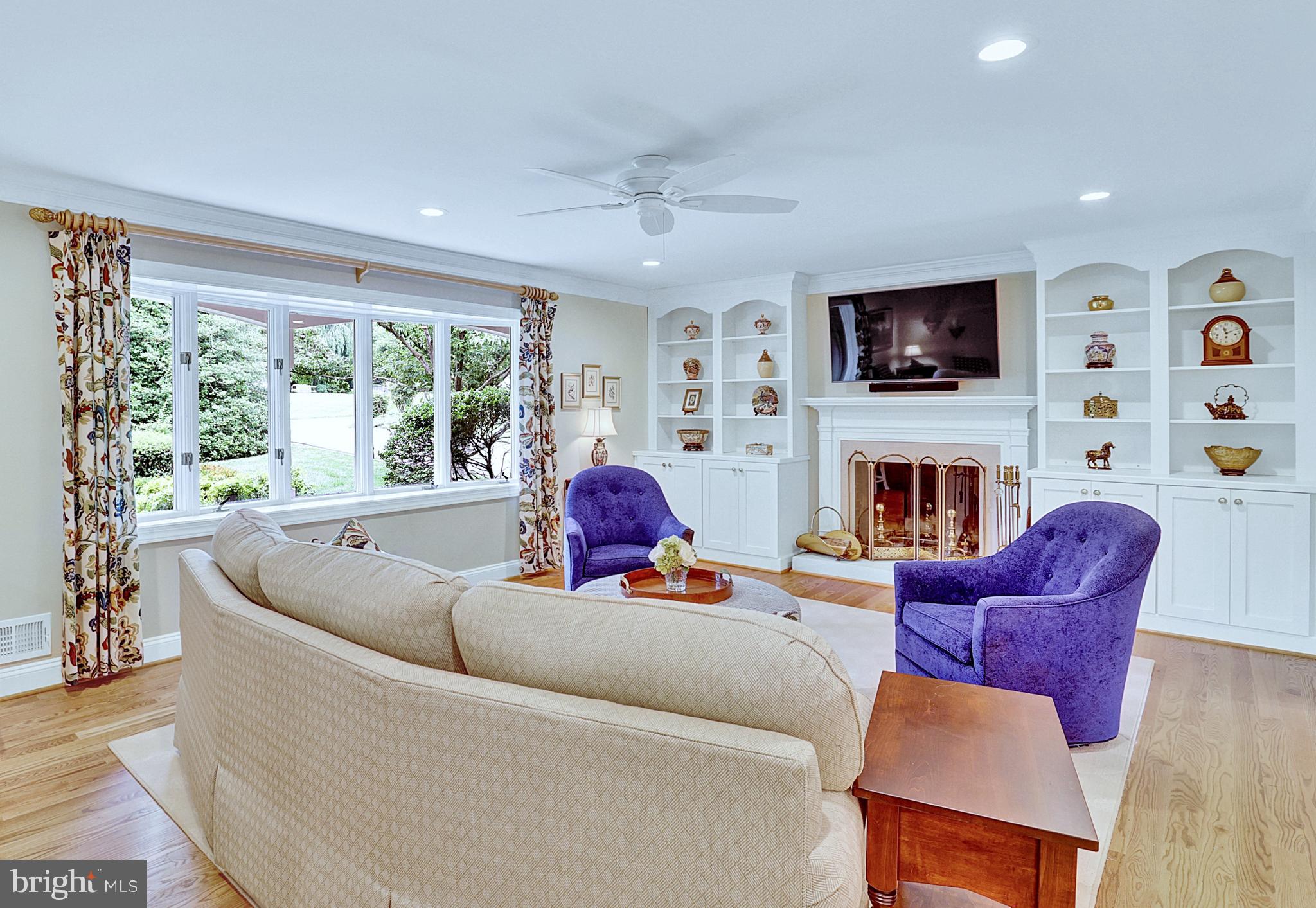 13713 Harcum Road Phoenix, MD 21131 - Photo 4 of 101 a living room with furniture a fireplace and a flat screen tv
