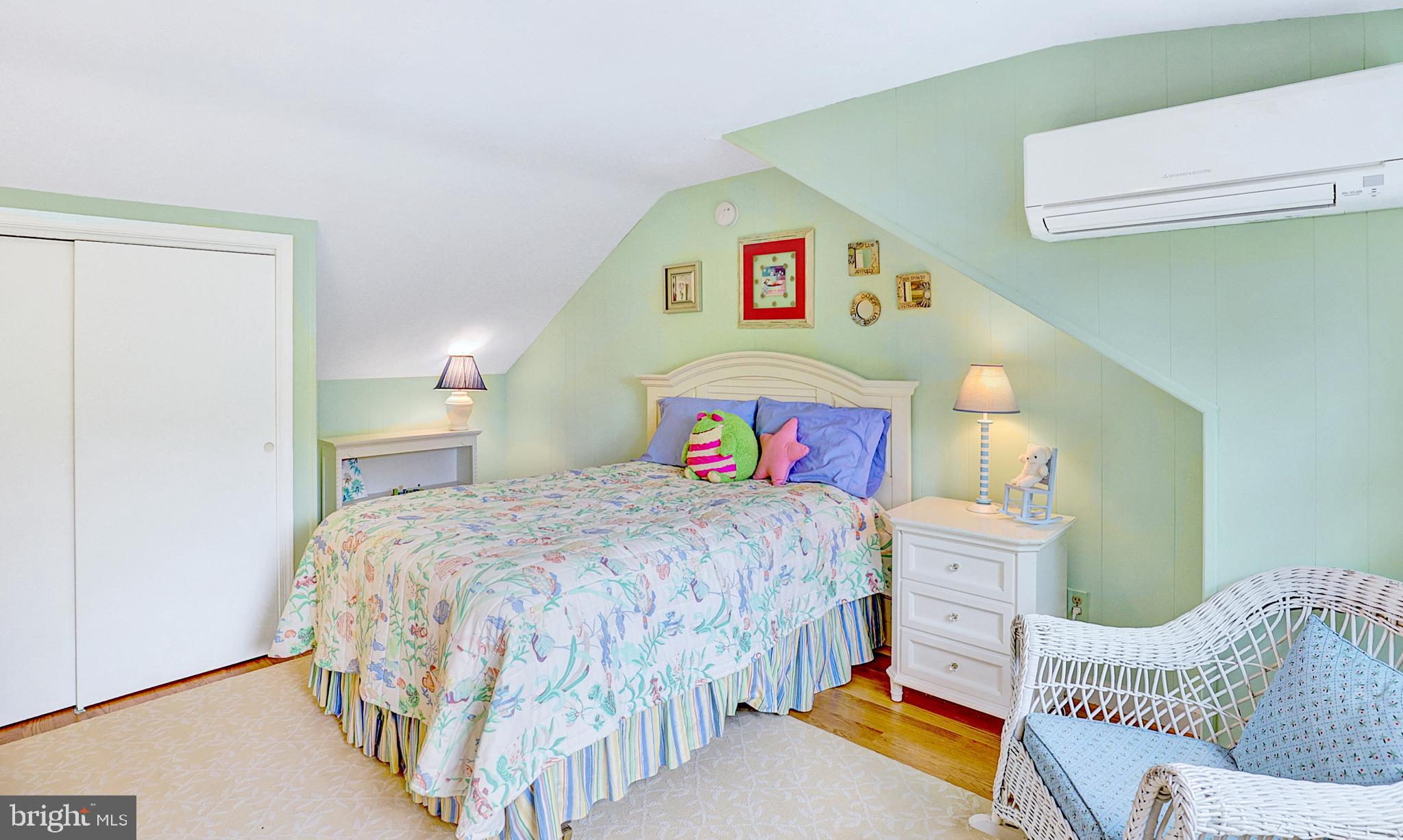 13713 Harcum Road Phoenix, MD 21131 - Photo 51 of 101 a bedroom with a bed and a lamp