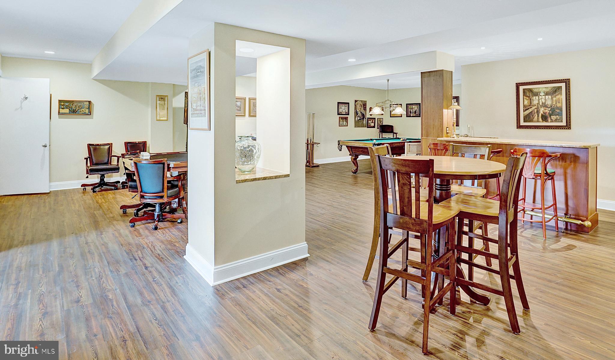 13713 Harcum Road Phoenix, MD 21131 - Photo 59 of 101 a view of a dining area with furniture and wooden floor