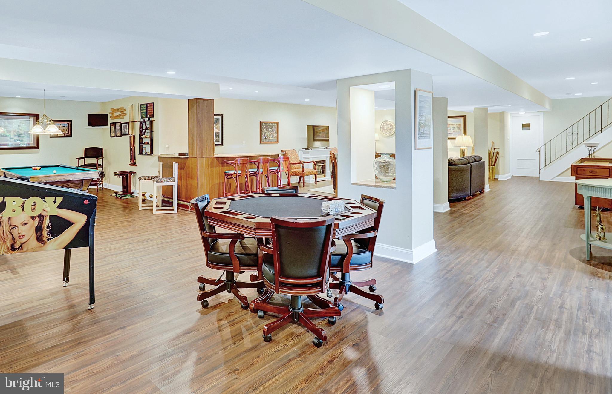 13713 Harcum Road Phoenix, MD 21131 - Photo 61 of 101 a dining room with furniture wooden floor and a rug