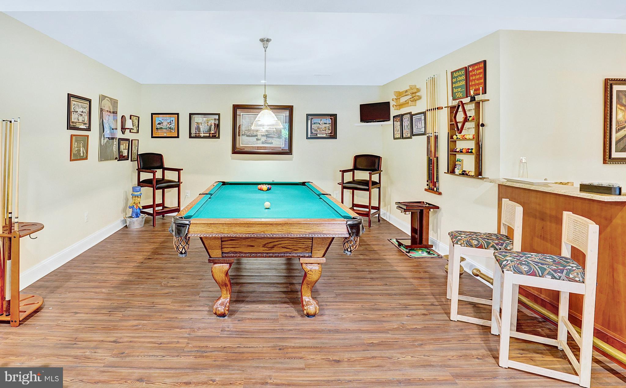 13713 Harcum Road Phoenix, MD 21131 - Photo 62 of 101 a room with furniture and a wooden floor
