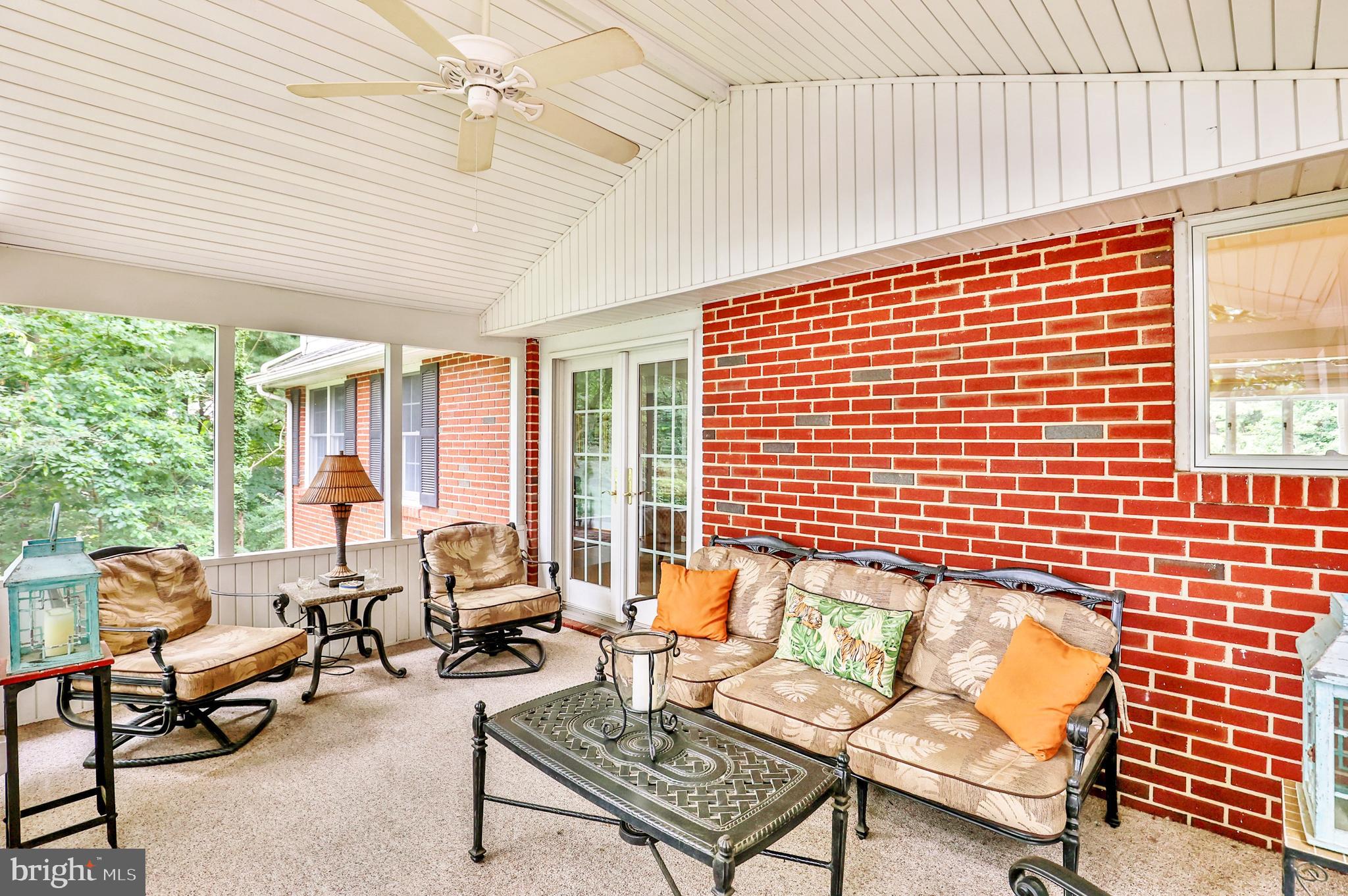 13713 Harcum Road Phoenix, MD 21131 - Photo 67 of 101 a outdoor living space with furniture and a ceiling fan
