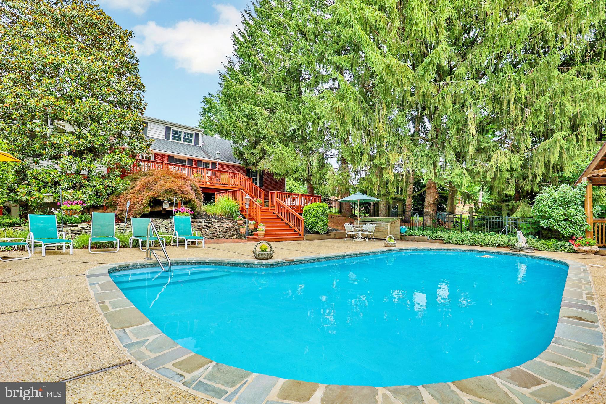 13713 Harcum Road Phoenix, MD 21131 - Photo 82 of 101 a view of a swimming pool with an outdoor space and seating area