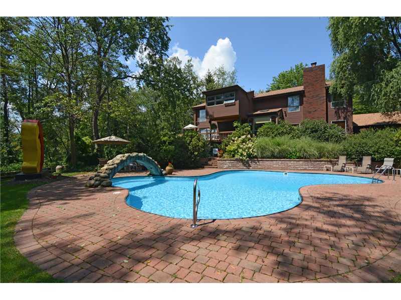 129 Riding Trail Lane Fox Chapel, PA 15215 - Photo 21 of 25 Swimming Pool/Hot Tub/Sauna. Relax on a hot summer day in the beautiful free form pool.