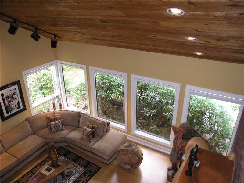 129 Riding Trail Lane Fox Chapel, PA 15215 - Photo 5 of 25 Living Room. View from second floor Loft Study of Living room below. Note the wall of windows, planked ceiling and recessed lighting.
