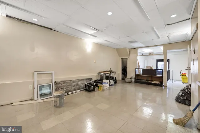 a room with furniture and a view of living room