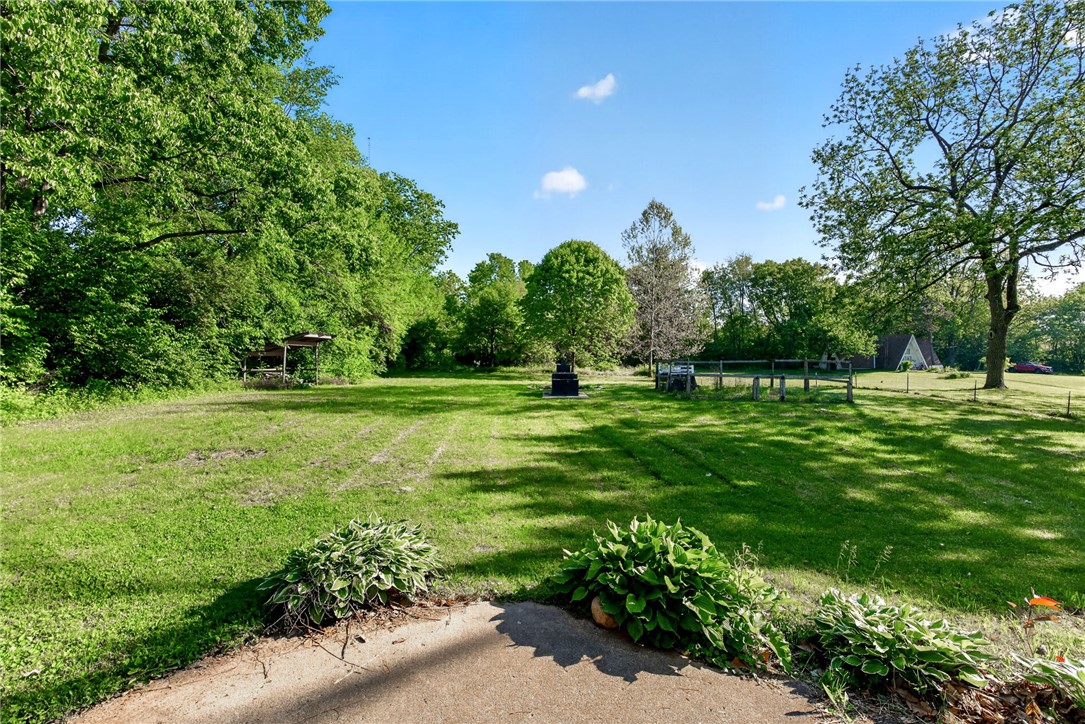 2684 Arthur Road Springfield, OH 45502 - Photo 54 of 69 Expansive green yard with mature trees offers a serene natural setting.