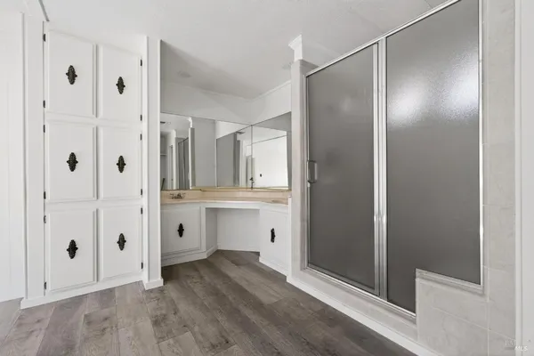 a view of a bathroom with a shower and a sink