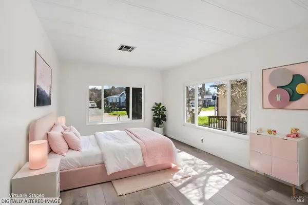 a bedroom with furniture and a window