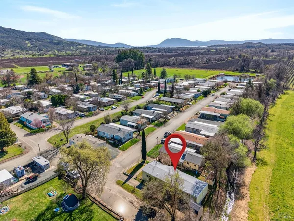 an aerial view of residential houses and outdoor space