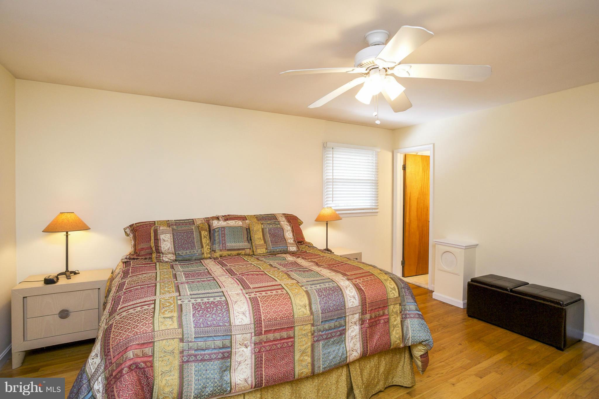 1712 Parkvue Road Fallston, MD 21047 - Photo 12 of 29 a bedroom with a bed and a chandelier