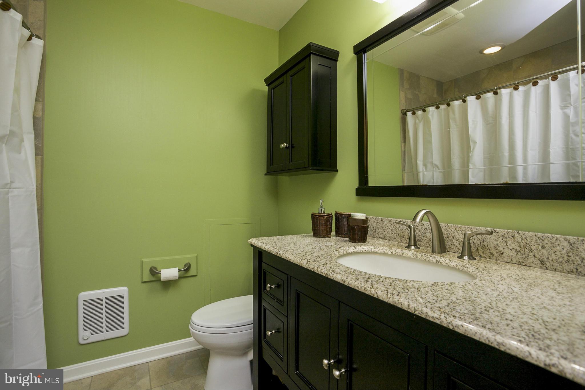 1712 Parkvue Road Fallston, MD 21047 - Photo 19 of 29 a bathroom with a granite countertop toilet sink and mirror