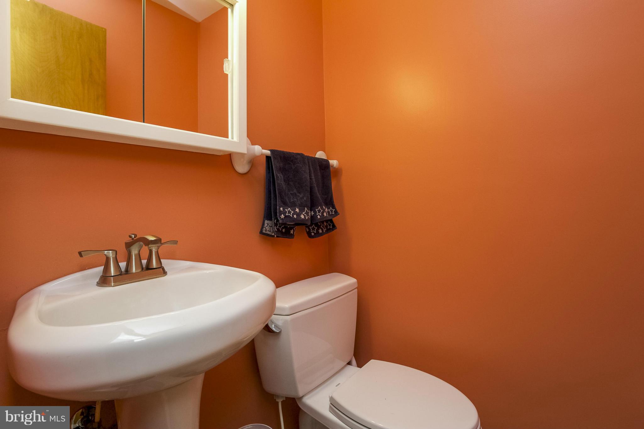 1712 Parkvue Road Fallston, MD 21047 - Photo 26 of 29 a bathroom with a toilet a sink and mirror