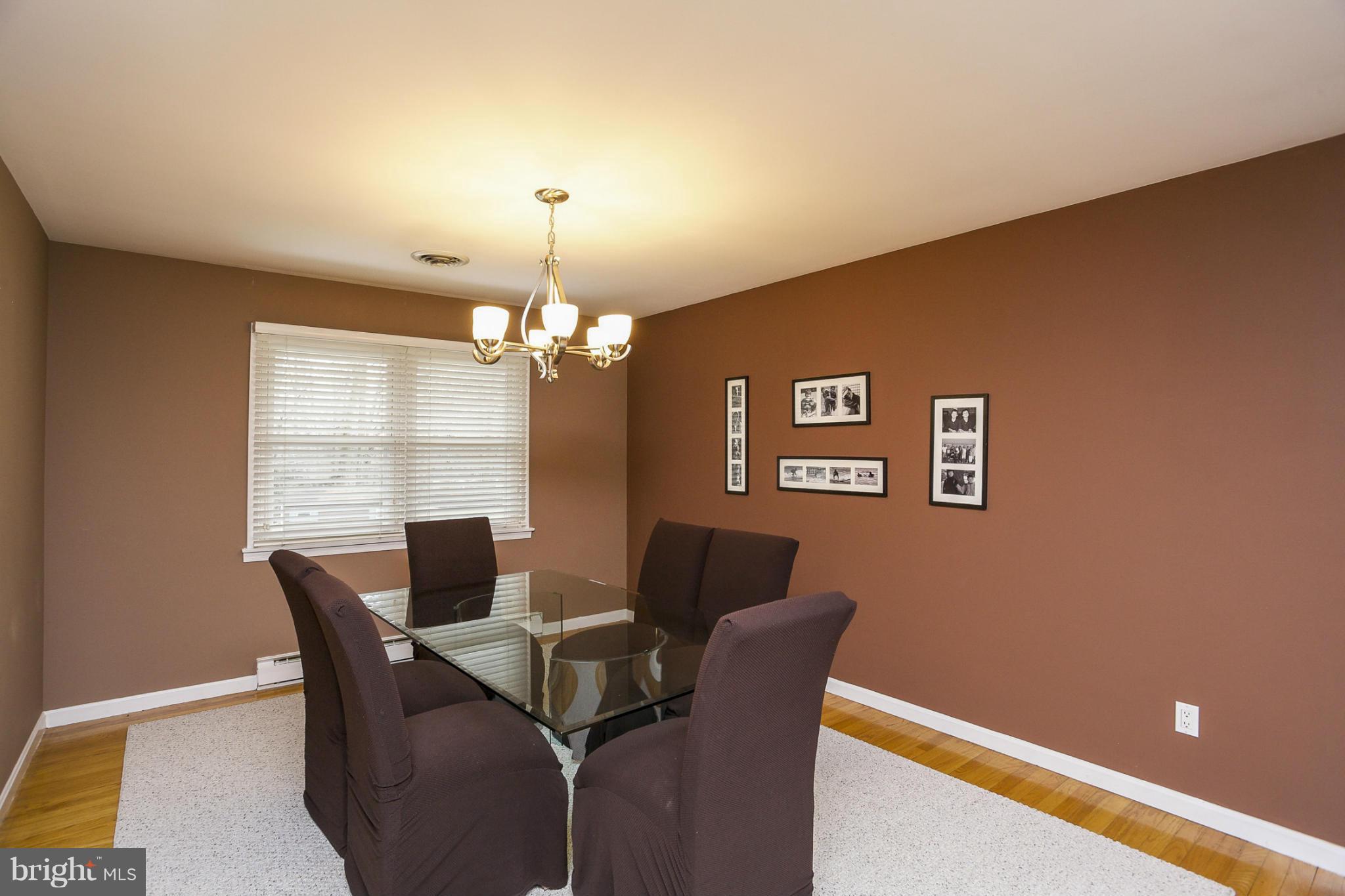 1712 Parkvue Road Fallston, MD 21047 - Photo 5 of 29 a view of a dining room with furniture wooden floor and chandelier