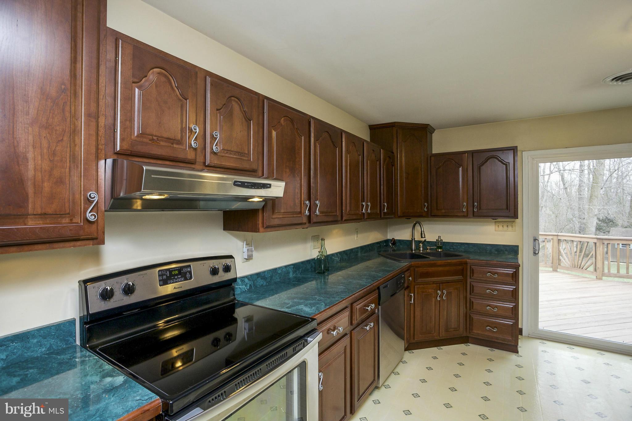 1712 Parkvue Road Fallston, MD 21047 - Photo 9 of 29 a kitchen with granite countertop a stove sink and cabinets