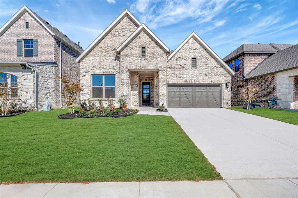 2901 Long Trail Mansfield, TX 76063 - Photo 1 of 28 a front view of a house with a garden and plants