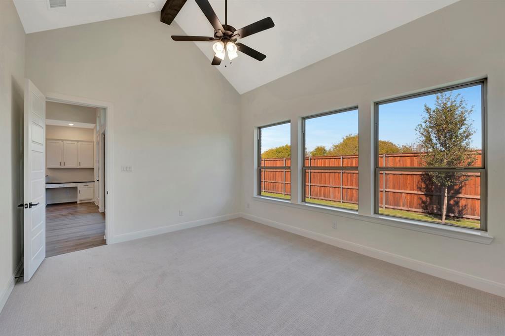 2901 Long Trail Mansfield, TX 76063 - Photo 11 of 28 an empty room with chandelier fan and windows