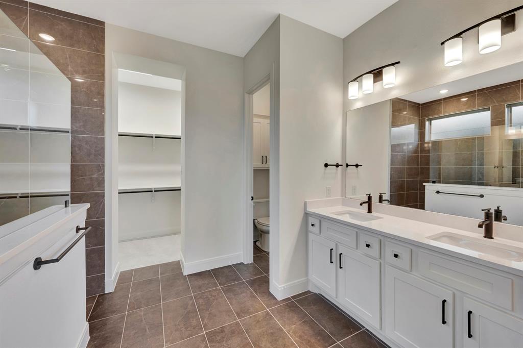 2901 Long Trail Mansfield, TX 76063 - Photo 12 of 28 a bathroom with a double vanity sink mirror and shower