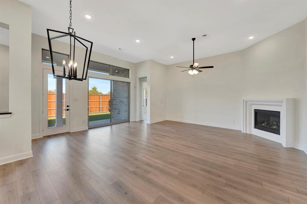 2901 Long Trail Mansfield, TX 76063 - Photo 25 of 28 a view of empty room with wooden floor and fireplace