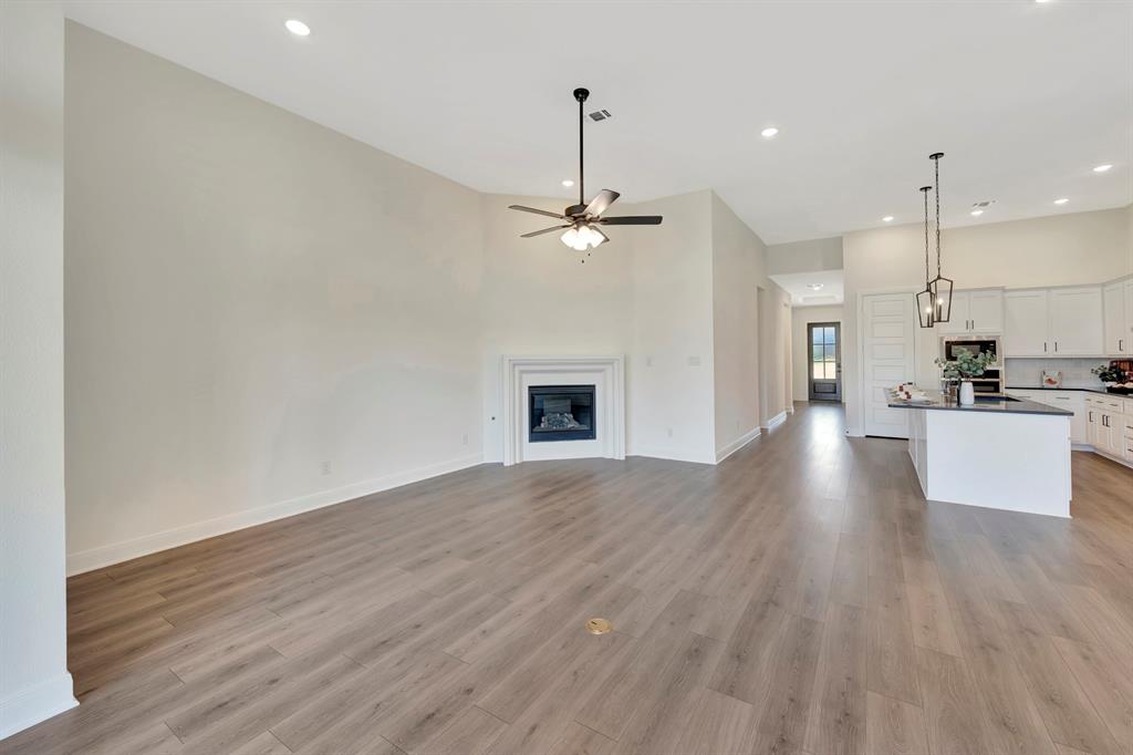 2901 Long Trail Mansfield, TX 76063 - Photo 26 of 28 a view of a kitchen with a stove wooden floor and a sink