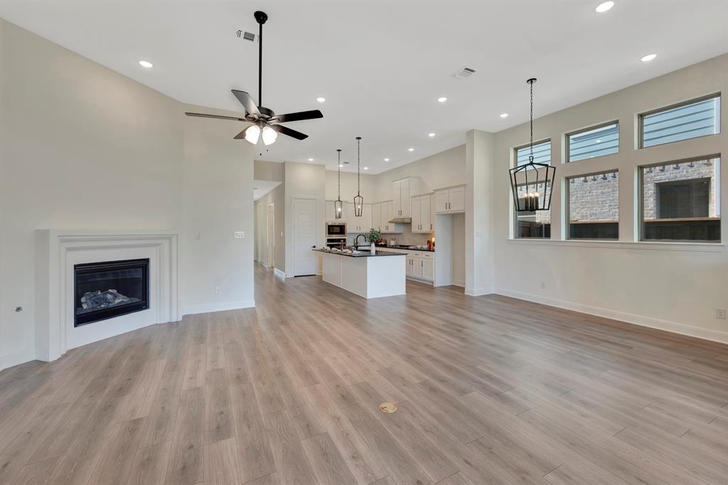 2901 Long Trail Mansfield, TX 76063 - Photo 27 of 28 a view of a kitchen with a stove cabinets and wooden floor