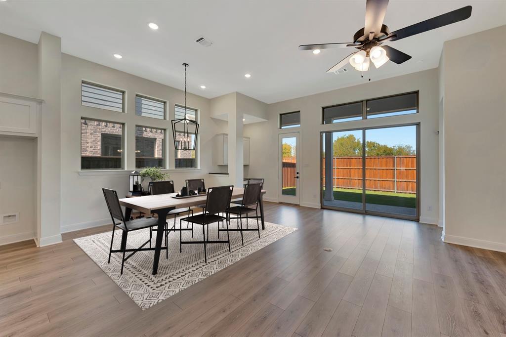2901 Long Trail Mansfield, TX 76063 - Photo 7 of 28 a view of a dining room with furniture window and wooden floor