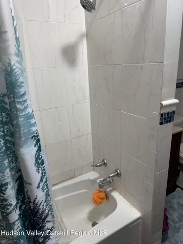 a bath tub sitting in a bathroom