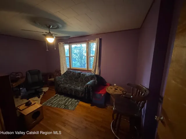 a bed sitting in a room next to a window