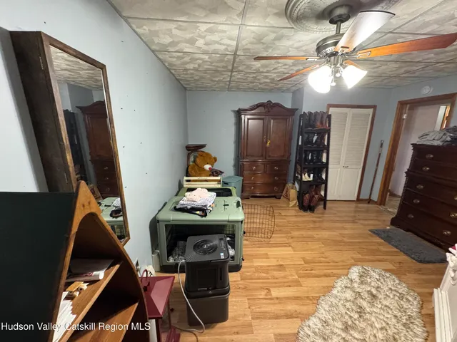 a view of living room with furniture and a flat screen tv