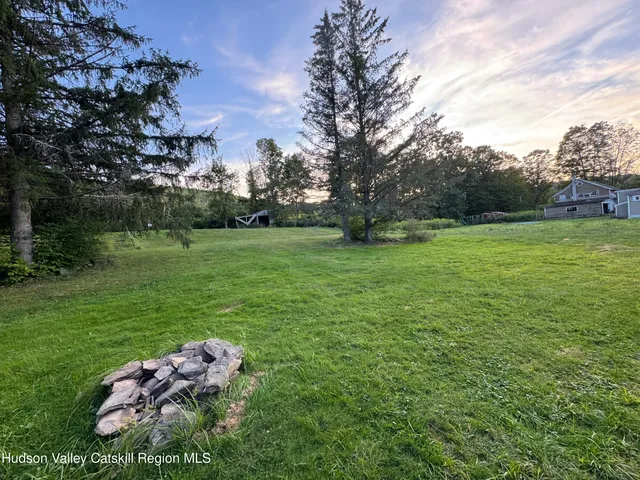 a backyard of a house with lots of green space