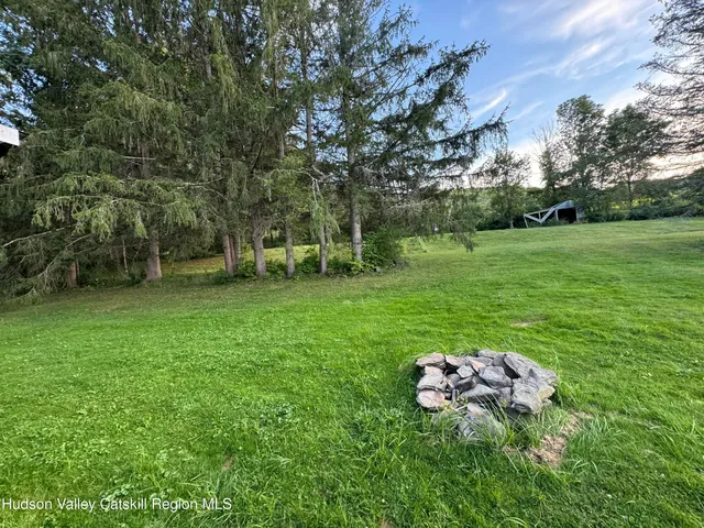 a view of a golf course with a tree