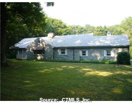 16 Old Mill Road Woodbridge, CT 06525 - Photo 1 of 1 a aerial view of a house with a yard table and chairs