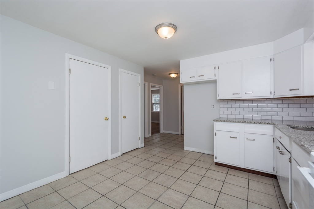 22 Southwest Cutoff, Unit C Northborough, MA 01532 - Photo 6 of 14 a view of a kitchen with white cabinets