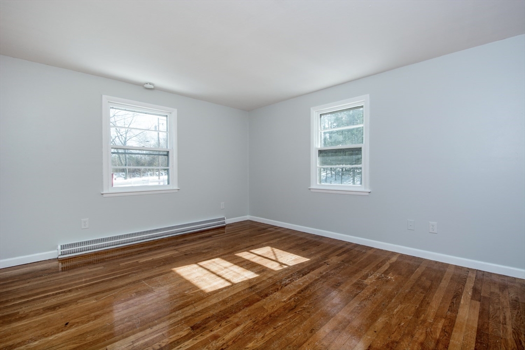 22 Southwest Cutoff, Unit C Northborough, MA 01532 - Photo 8 of 14 a view of empty room with window