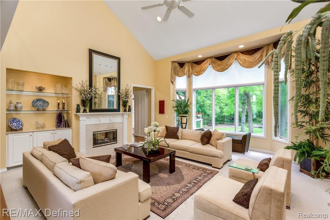 5637 Kirkridge Trail Rochester, MI 48306 - Photo 5 of 36 This gorgeous great room offers a stunning view of the gorgeous wooded lot.