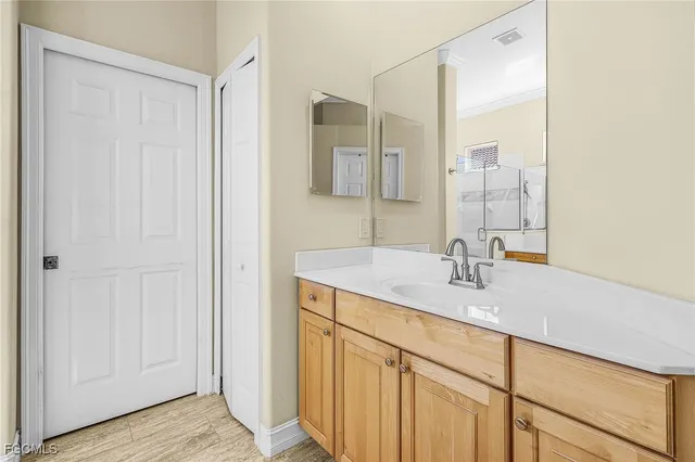 a bathroom with a sink and a mirror