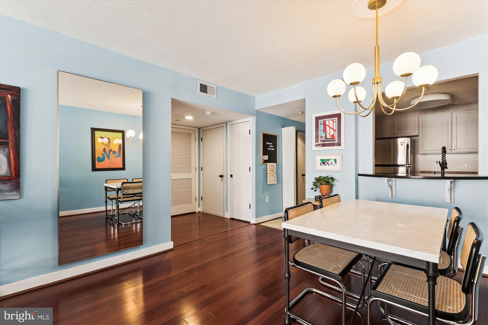 1150 K Street Northwest, Unit 706 Washington, DC 20005 - Photo 12 of 34 a view of a dining room with furniture and wooden floor