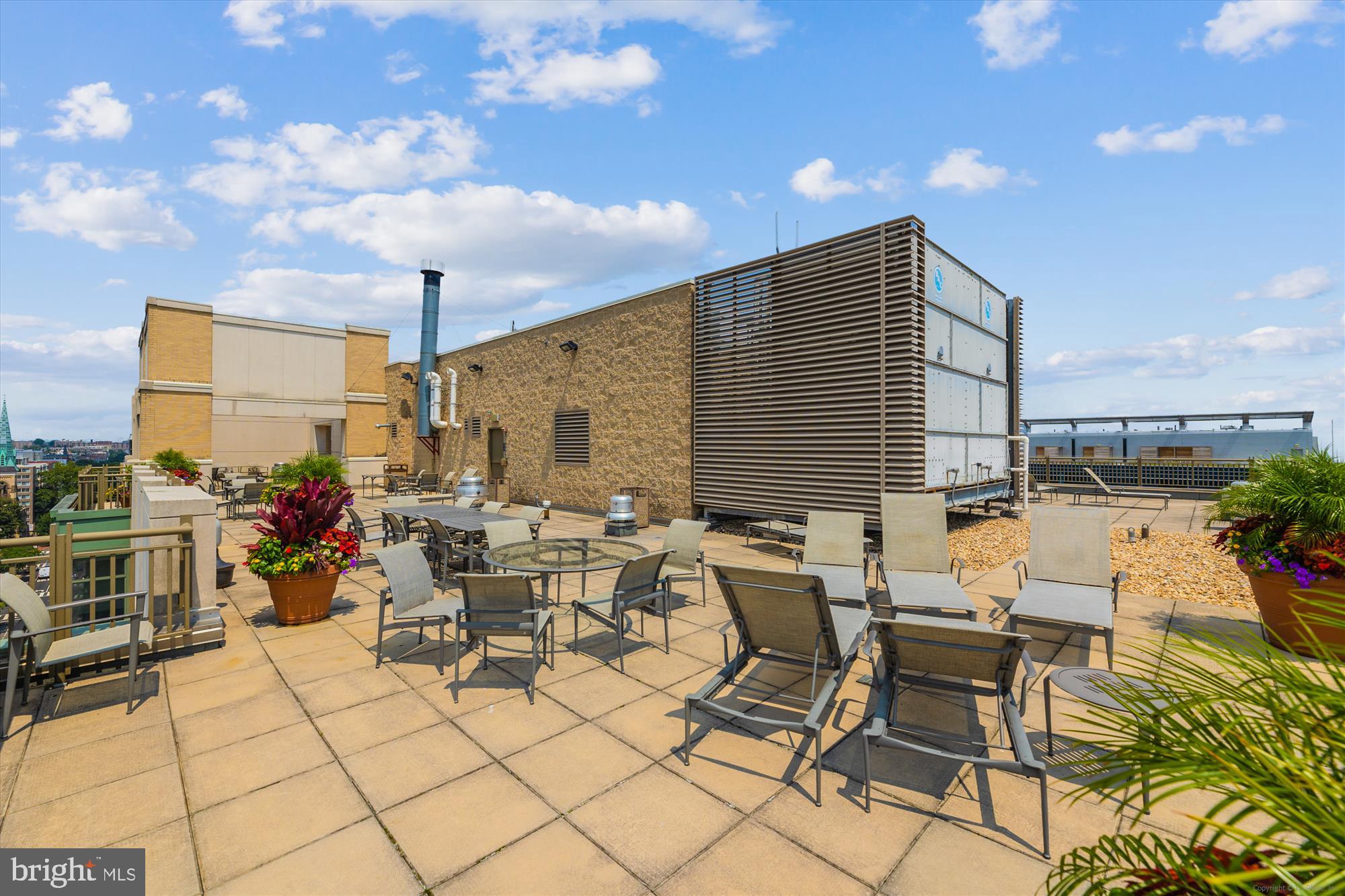 1150 K Street Northwest, Unit 706 Washington, DC 20005 - Photo 22 of 34 a view of a patio with dining table and chairs