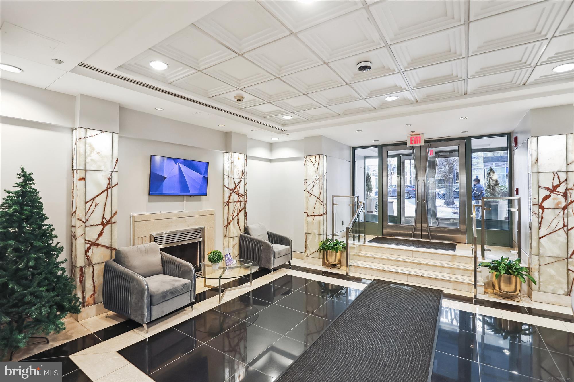 1150 K Street Northwest, Unit 706 Washington, DC 20005 - Photo 26 of 34 a living room with furniture and a fireplace
