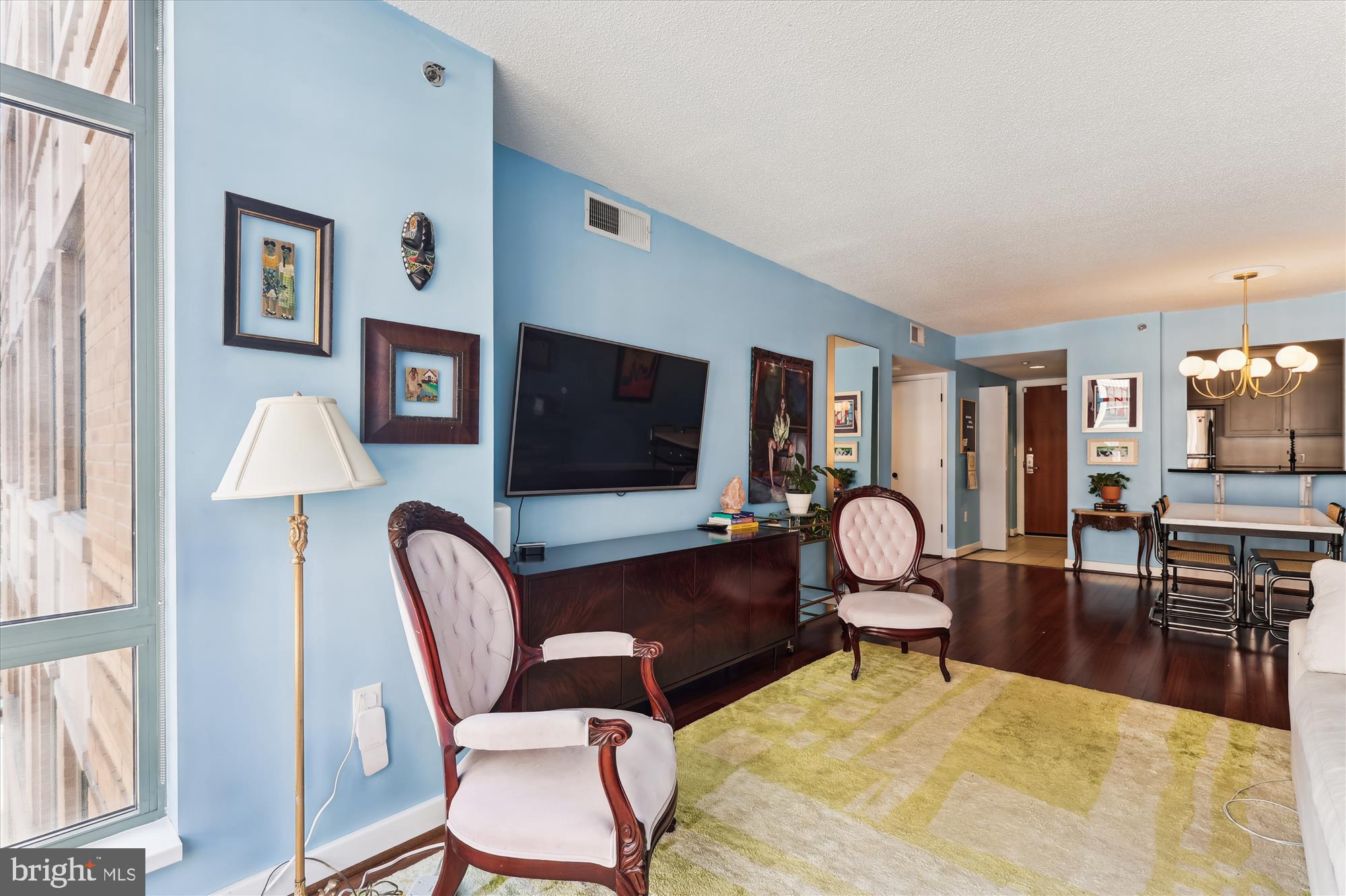 1150 K Street Northwest, Unit 706 Washington, DC 20005 - Photo 4 of 34 a view of a livingroom with furniture
