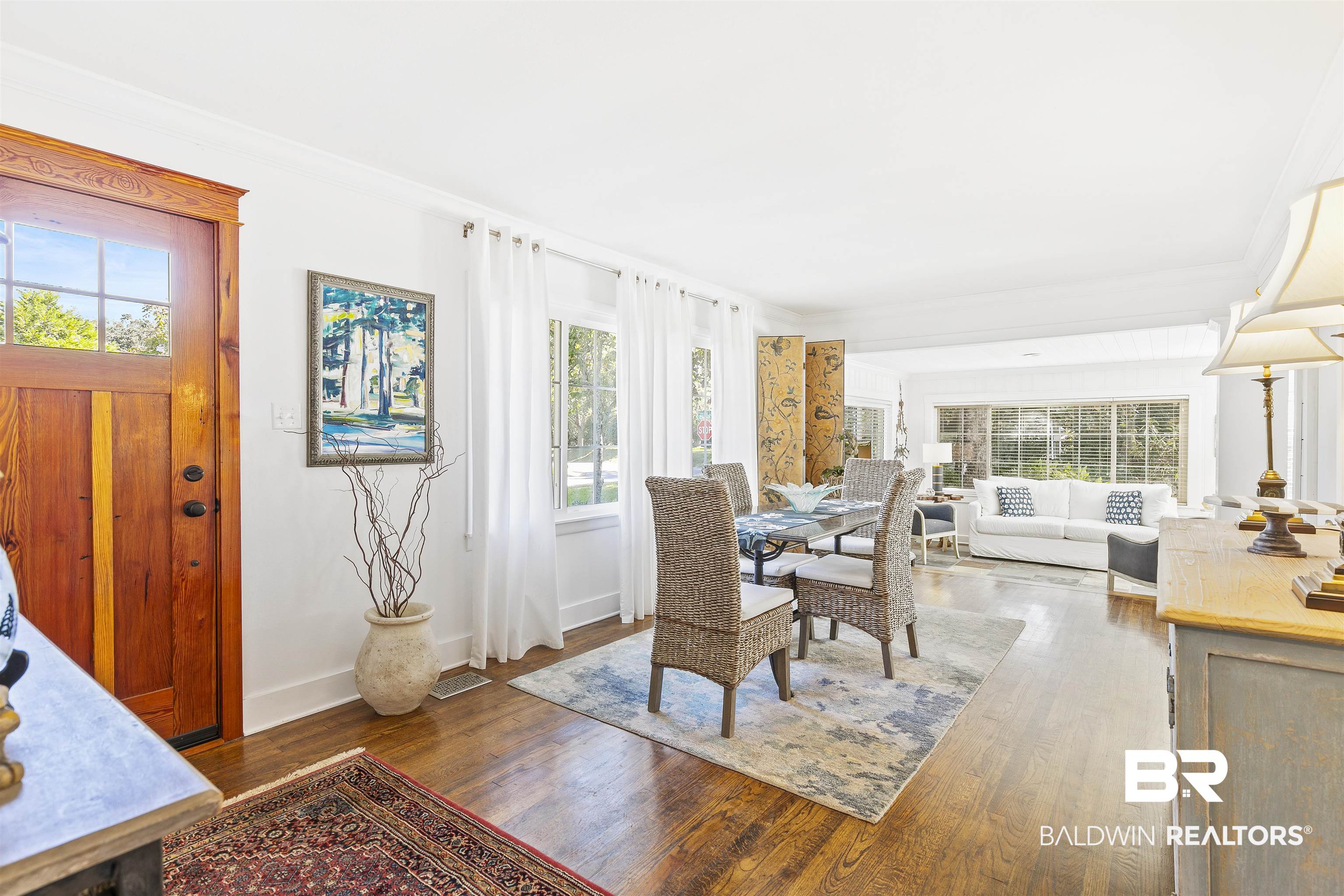 220 Pinecrest Lane Fairhope, AL 36532 - Photo 6 of 32 Dining area featuring dark wood-type flooring and crown molding
