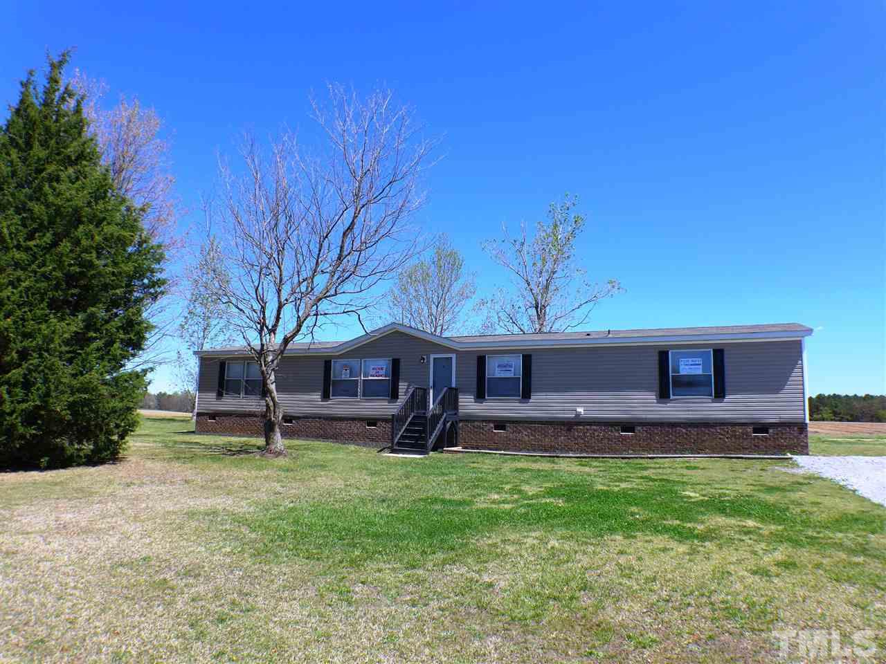7515 Bill Love Road Willow Spring, NC 27592 - Photo 1 of 20 a view of a house with a yard