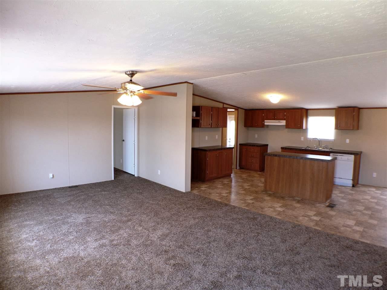 7515 Bill Love Road Willow Spring, NC 27592 - Photo 2 of 20 a view of a kitchen with a sink