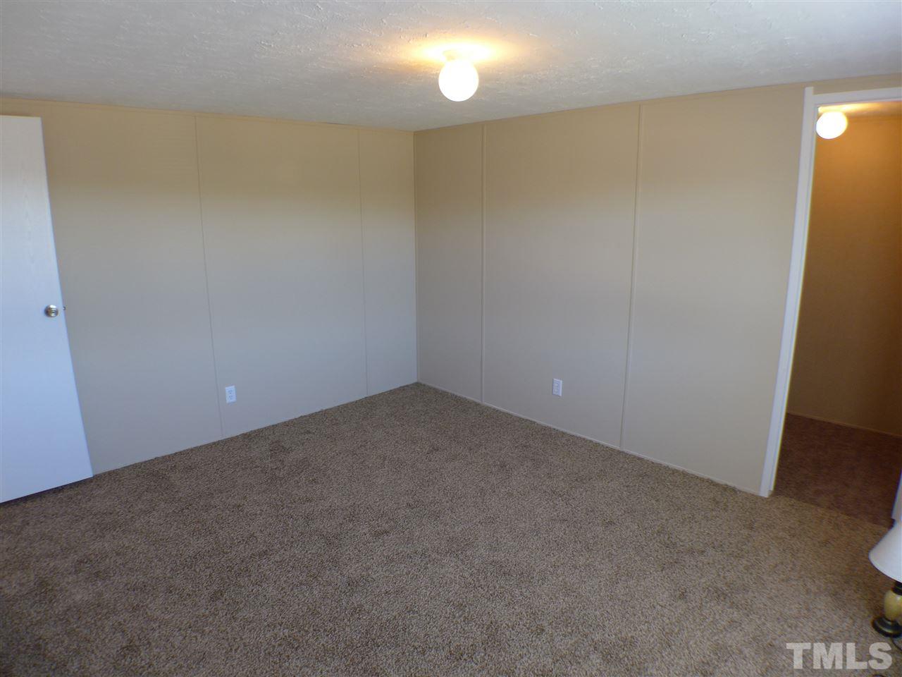 7515 Bill Love Road Willow Spring, NC 27592 - Photo 14 of 20 a view of an empty room