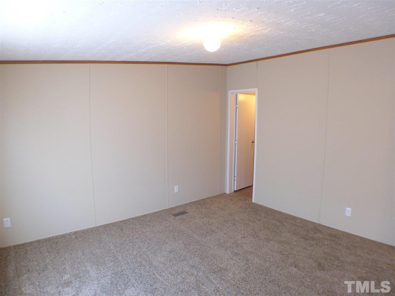 7515 Bill Love Road Willow Spring, NC 27592 - Photo 16 of 20 a view of an empty room