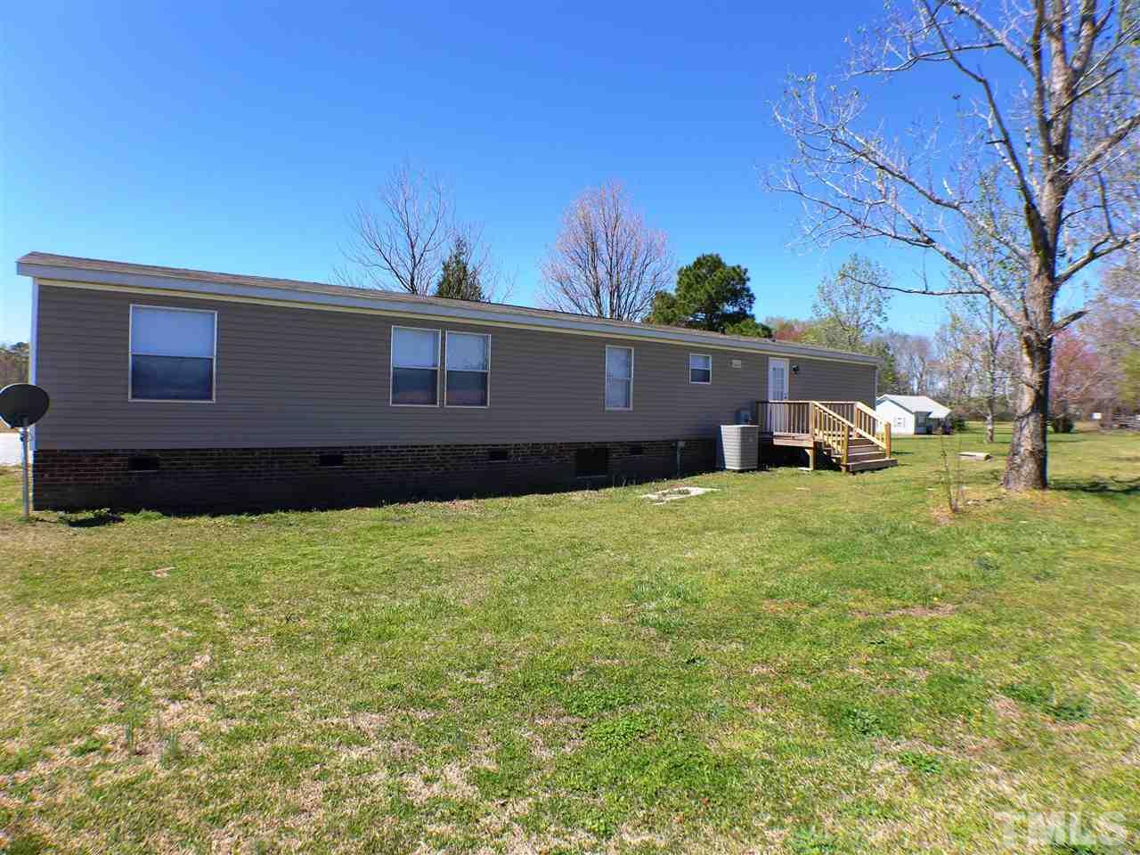 7515 Bill Love Road Willow Spring, NC 27592 - Photo 17 of 20 a house view with a garden space