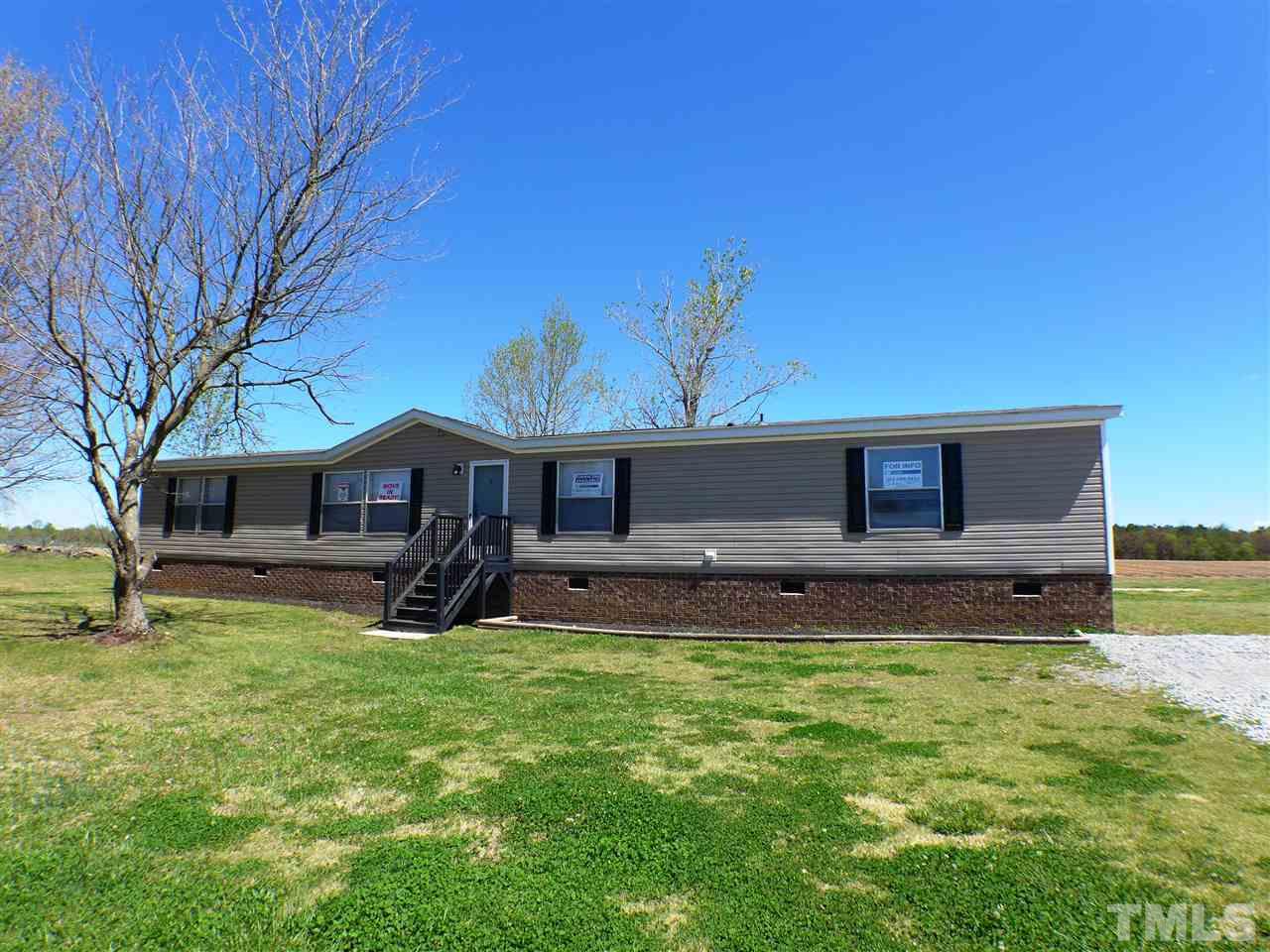 7515 Bill Love Road Willow Spring, NC 27592 - Photo 20 of 20 a view of a house with a yard