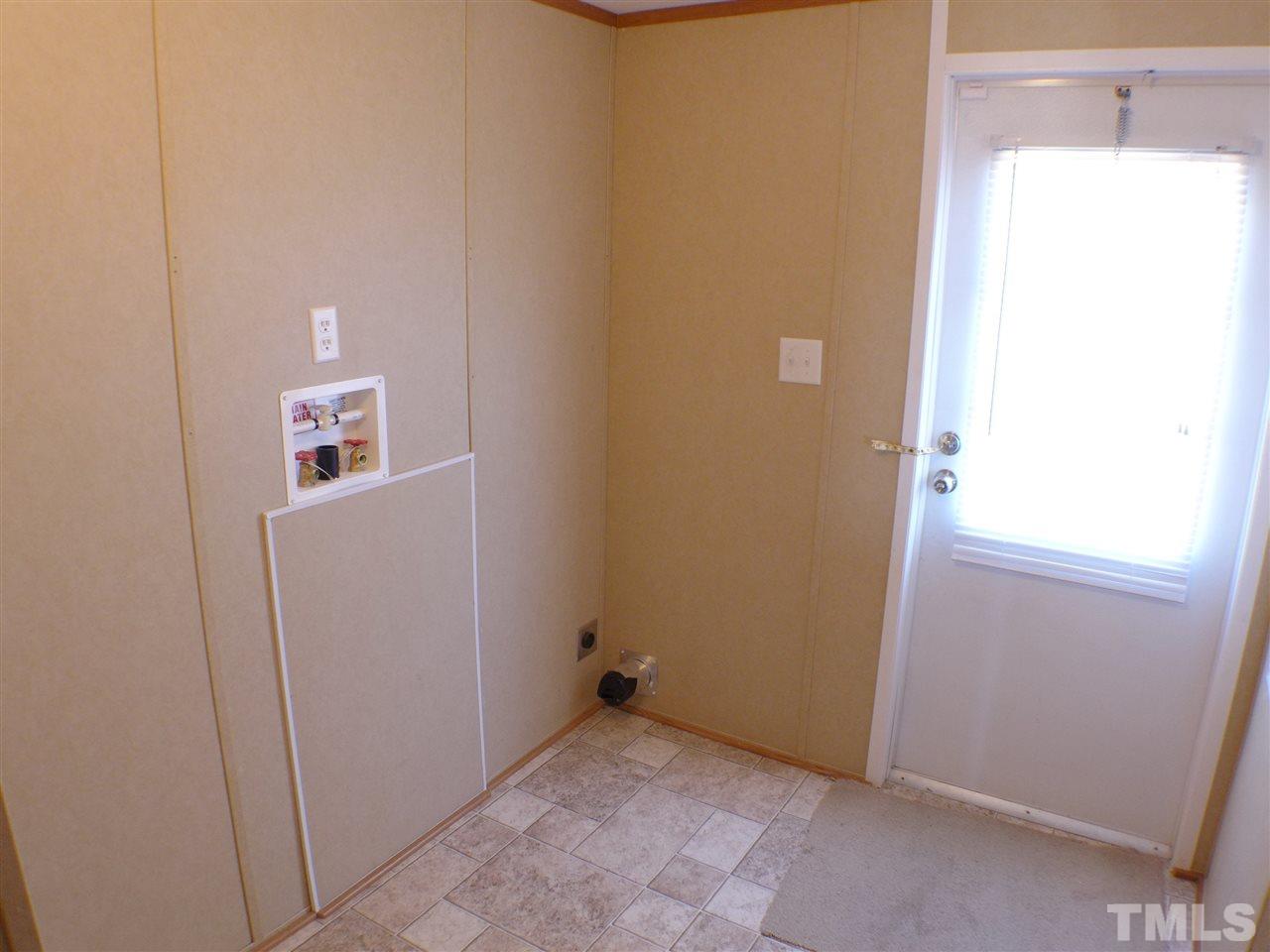 7515 Bill Love Road Willow Spring, NC 27592 - Photo 6 of 20 a view of a hallway with closet