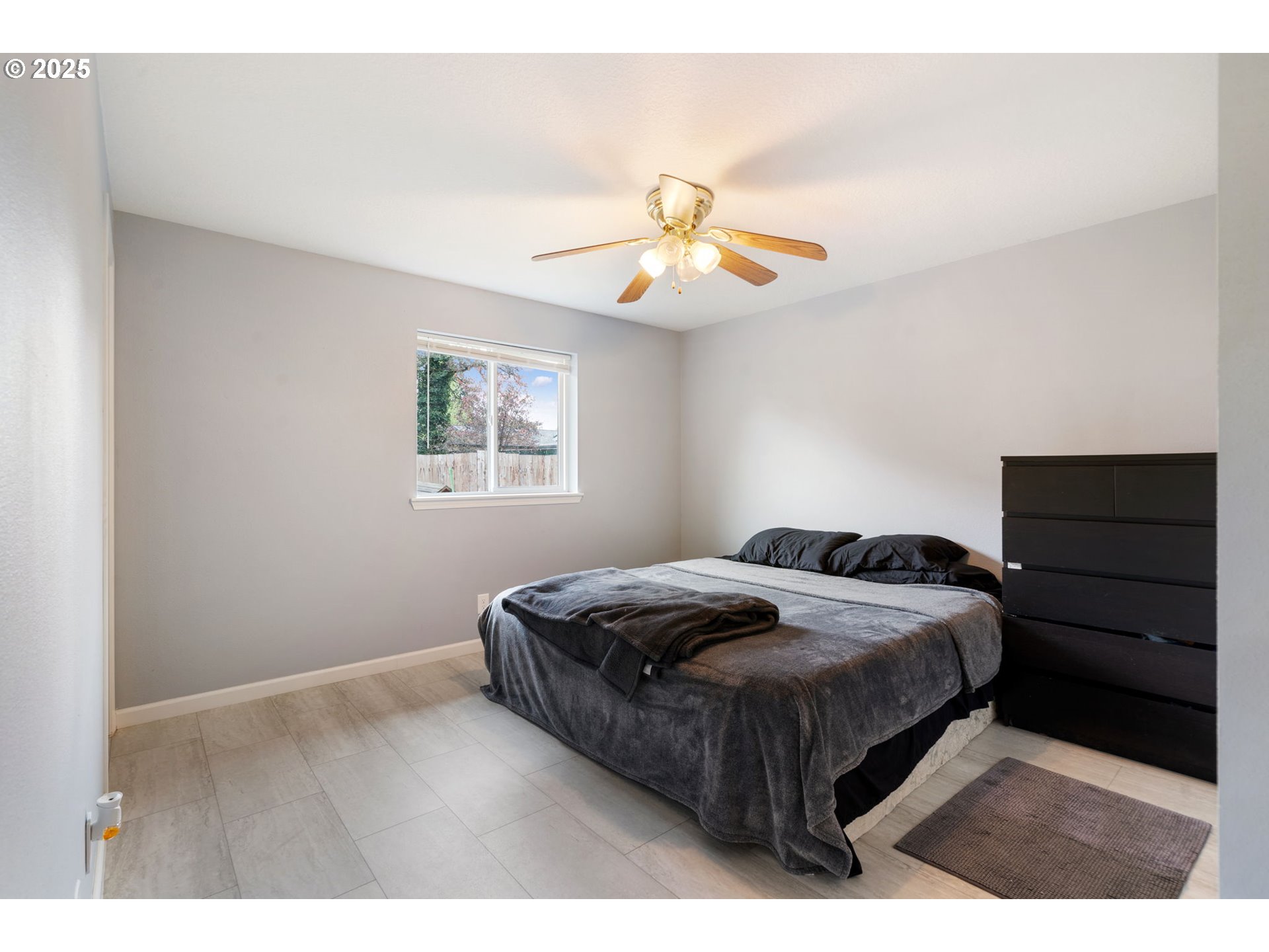 453 North 11th Street St. Helens, OR 97051 - Photo 11 of 20 a bedroom with a bed and a chandelier